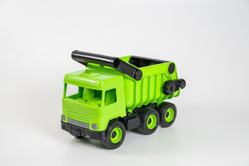 Plastic car. Toy model isolated on a white background. Green truck.