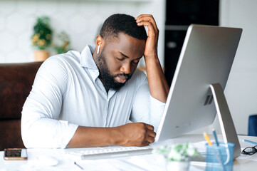 Asleep employee. Handsome tired sleepy African American bearded male manager, broker or freelancer, in formal clothes, working at home at computer, took a break, closing his eyes, need rest