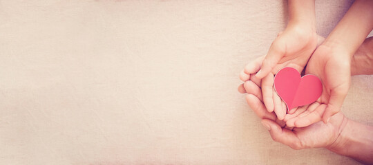 hands holding red heart, heart health, donation, happy volunteer charity, CSR social...