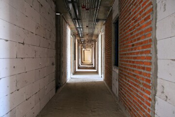 Brick wall in walkway under construction