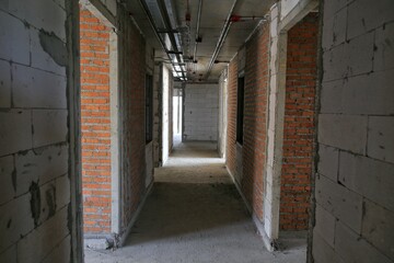 Red brick walls, which have not been plastered.