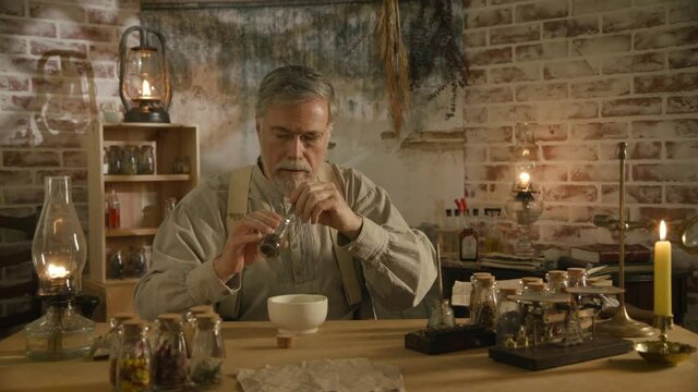 A scene from the 19th century of an apothecary using a mortar and pestle to grind herbs for the medicine.