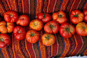 Red ripe tasty fresh delicious tomato vegetables in bazaar market