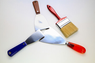 Trowels of various sizes and paint brushes.