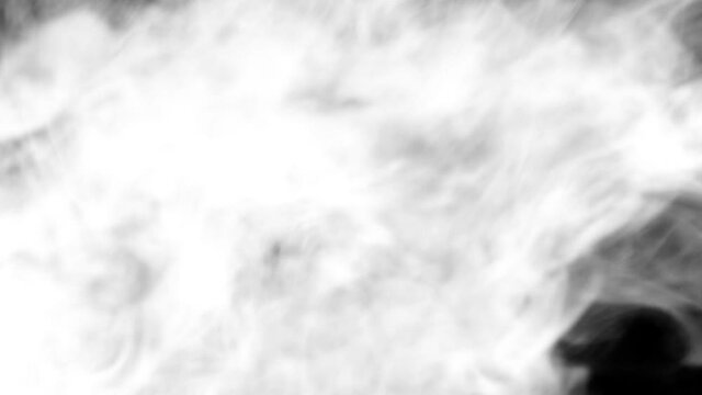 Bright white smoke smoke on a black background slow motion. The start of movement of the clouds from right to left slowly. The concept of transitions for video editing using the alpha channel.