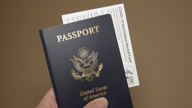 Travel concept - close up of US passport with Covid-19 vaccination record card. Illustrative Editorial taken in Vista, CA USA on April 4, 2021. 