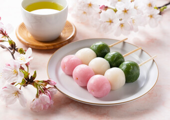 Fototapeta na wymiar Sanshoku dango and green tea. An image of Japanese spring