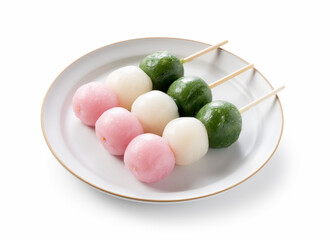 Tricolor dumplings placed on a white background.