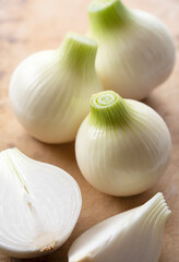 New onions on a wooden background
