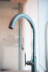 Water dripping from the faucet,Concept of water saving