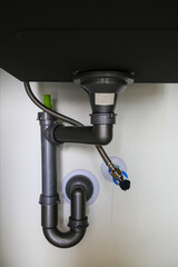 Water stains are leaking under the sink.