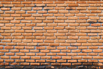 Red brick walls are bare, not plastered.