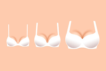 Three white brassieres with cups of different sizes - obrazy, fototapety, plakaty