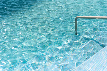 clear blue shining swimming pool water, shiny water ripples