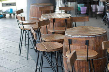 Wine barrels converted to bar tables and chairs, good idea, beautiful design in the restaurant.