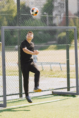 Sporman is playing football and practising with the ball