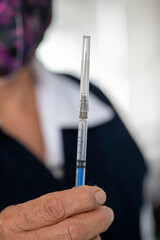 Covid-19 vaccine in a syringe