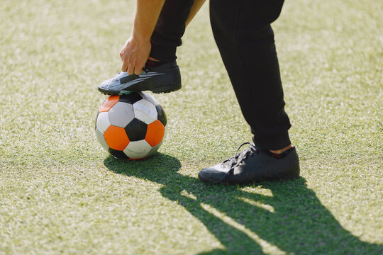 Sporman is playing football and practising with the ball