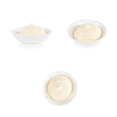 Mayonnaise in a round saucepan. Different angles. On a white background. Isolate.