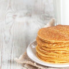Sweet pancakes served with milk.