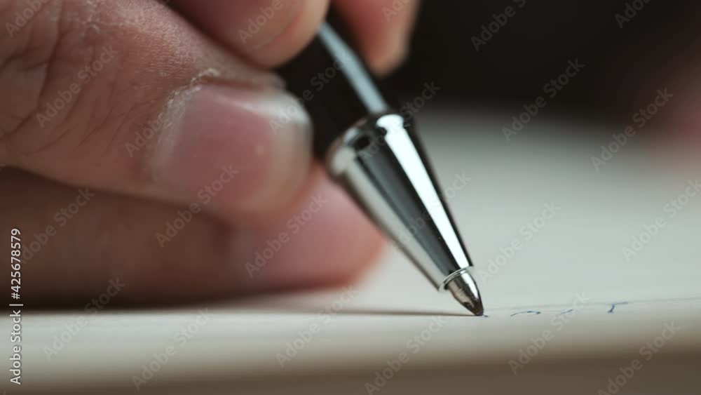 Poster Close-up view of a handwriting down on a white blank notebook