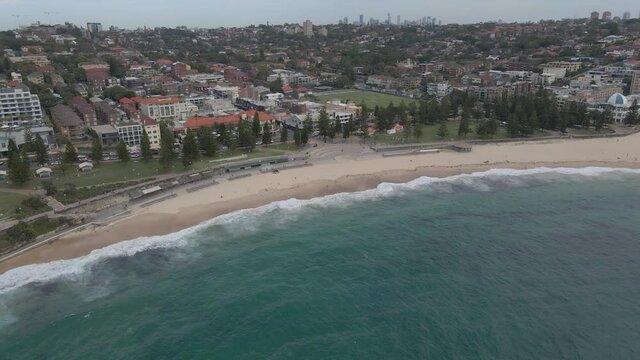 Aerial View Of Coogee Beach Canteen And Goldstein Reserve. Uncrowded Coogee Beach During Coronavirus Pandemic In Sydney, Australia. drone approach