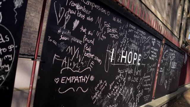 Message of hope written on black chalkboard outside a church in London, people wrote their hopes and dreams during Covid-19 Coronavirus pandemic