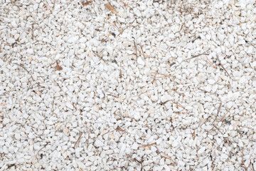Background of white marble chips. Crushed marble stone. Natural surface pattern sandstone