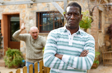 Conflict between neighbors in the country cottage. High quality photo