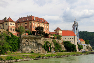 Fototapeta na wymiar Blue Church and buildings in Austria along Danube river 