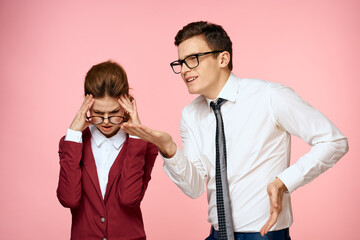 Man and woman work colleagues professionals officials pink background