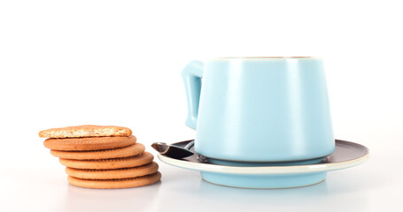 A cup of coffee and a pile of biscuits