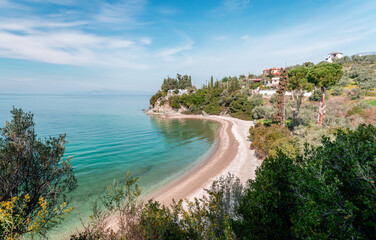 Fototapeta na wymiar High angle view of Lagoudi beach in Afissos, a traditional village built amphitheatrically on the slopes of Mount Pelion, with view to the Pagasetic Gulf. Magnesia, Thessaly, Greece.