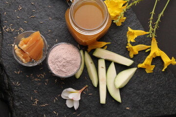 Raw Mango juice - Aam Panna or Panha in a transparent glass with whole green fruit,