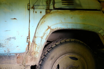 Old rusty truck in garage in sunlight