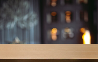 Empty wooden table in front of abstract blurred background of coffee shop . can be used for display or montage your products.Mock up for display of product