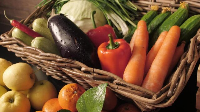 Assortment of fresh vegetables and fruits on wooden table