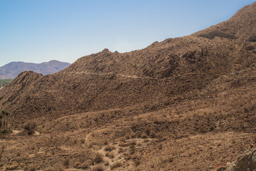 Hiking Trail Through Desert Rock Mountains