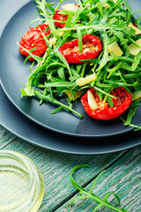 Vegetable salad with sun-dried tomato and arugula