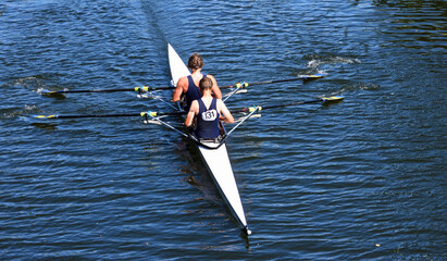 Womens  Pairs Sculling on the river Ouse blue tops.