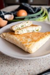 a plate of rolls with cheese and herbs