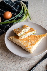 a plate of rolls with cheese and herbs