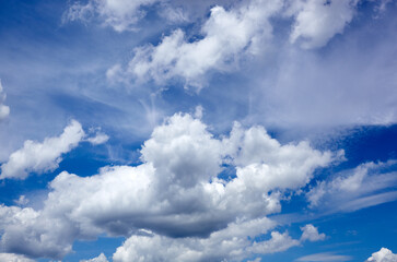 Naklejka na ściany i meble Blue sky background with cumulus clouds