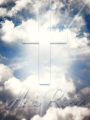 He is risen. Happy Easter. Cross in the heavenly blue sky with clouds and sun rays