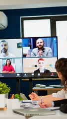 Headshot screen application view of remote multiracial employees talking on video call brainstorm...
