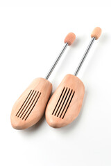 Wooden shoe lasts on a white background.