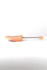 Wooden shoe lasts on a white background.