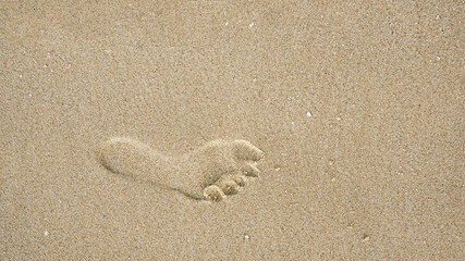 Footprints on the beach sand, Surface of human footmarks on smooth sand at the seaside, In summer, Texture background