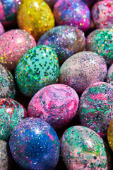 Many colorful shiny eggs. Concept of Happy Easter.