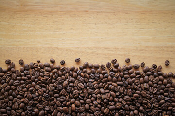 Coffee beans on wood background 